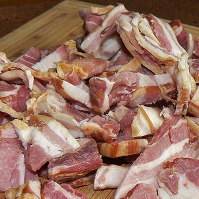 Illustration of farm bacon and pork cuts, shown until a real photograph of our hogs is available