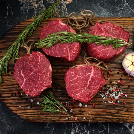 Steaks on a cutting board